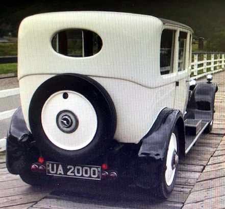 A Lanchester motor car displayed at an event